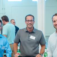 Three guests at a table at the Engineering Design Project Preview